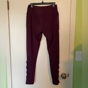 Leg3nd maroon athletic pants with calf embellishments